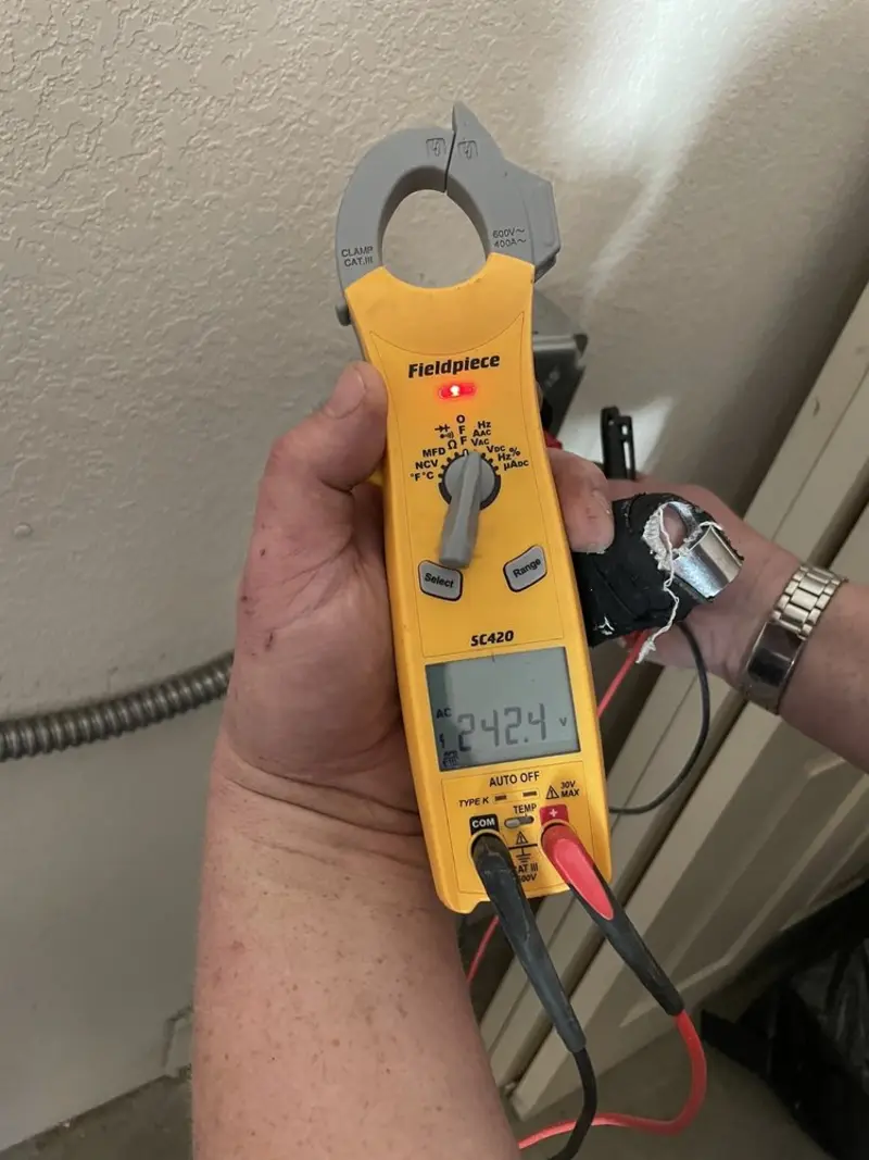 Voltage testing with clamp meter during Outlet Installation in Delanco